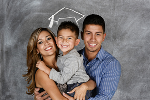 Parents holding young boy